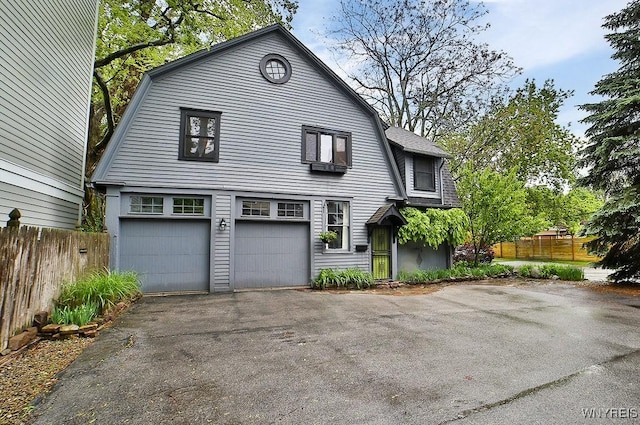 403 Elmwood Ave, Buffalo, NY 14222 - dutch colonial with a gambrel roof, driveway, a garage, and roof with shingles