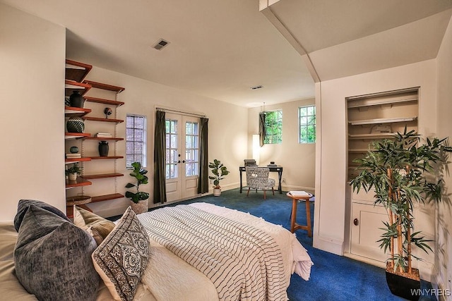 403 Elmwood Ave, Buffalo, NY 14222 - bedroom featuring carpet floors, french doors, arched walkways, and baseboards