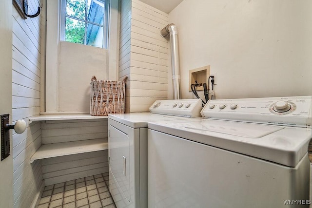 403 Elmwood Ave, Buffalo, NY 14222 - washroom featuring washer and dryer, wood walls, and light floors