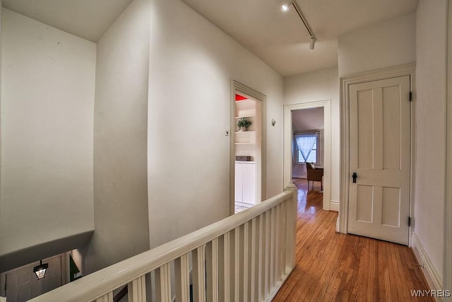 403 Elmwood Ave, Buffalo, NY 14222 - hall with an upstairs landing, wood finished floors, and track lighting