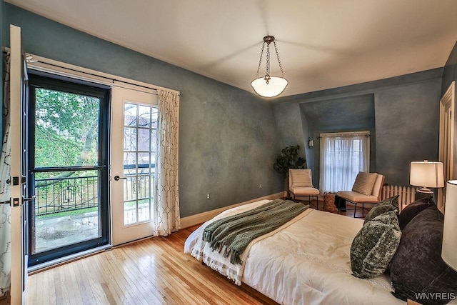 403 Elmwood Ave, Buffalo, NY 14222 - bedroom featuring access to outside, hardwood / wood-style floors, and baseboards