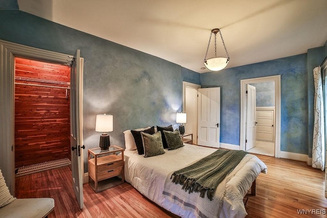 403 Elmwood Ave, Buffalo, NY 14222 - bedroom featuring light wood-type flooring and baseboards