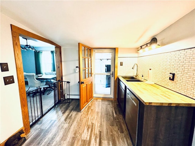 245 Owego St, Montour, NY 14865 - kitchen with a sink, wood finished floors, wooden counters, dishwasher, and a baseboard radiator