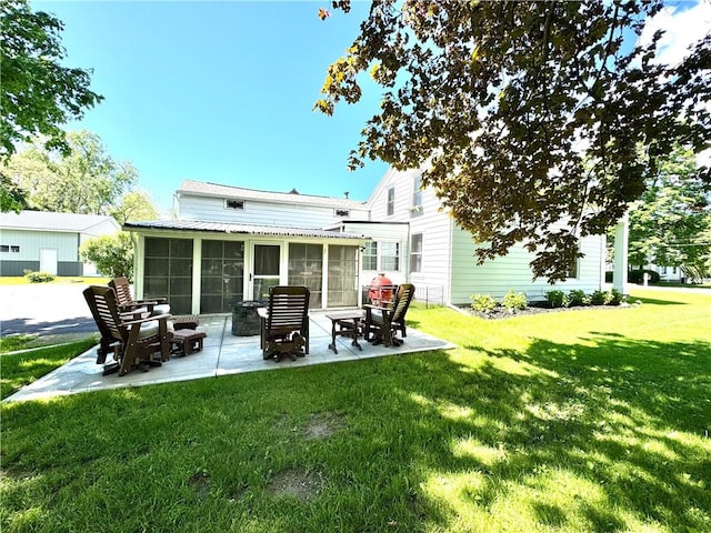 245 Owego St, Montour, NY 14865 - back of property featuring a sunroom, a patio, and a yard
