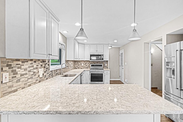 5 Glencrest Blvd, New Hartford, NY 13413 - kitchen with appliances with stainless steel finishes, a sink, decorative backsplash, white cabinets, and recessed lighting