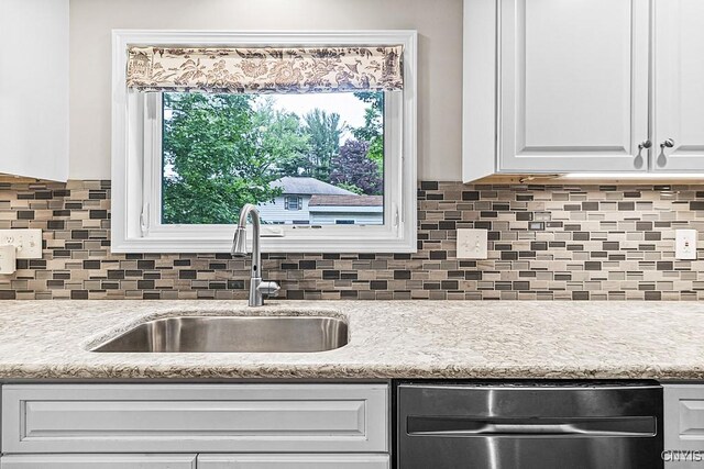 5 Glencrest Blvd, New Hartford, NY 13413 - kitchen with stainless steel dishwasher, a sink, white cabinets, and light countertops