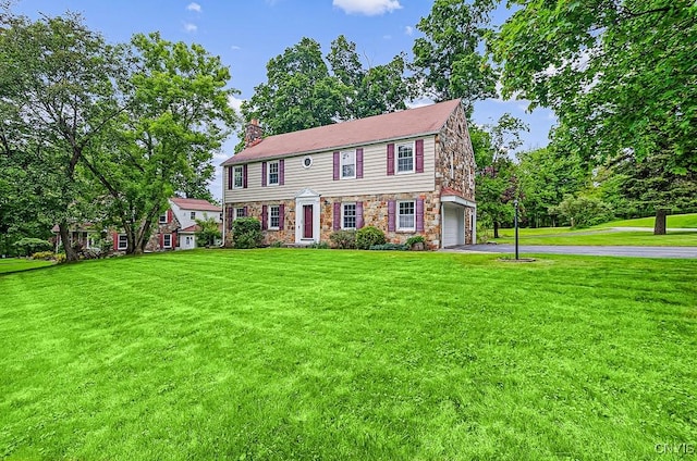 5 Glencrest Blvd, New Hartford, NY 13413 - view of front of house featuring driveway, an attached garage, a chimney, and a front yard