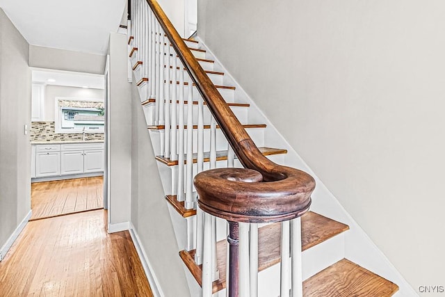 5 Glencrest Blvd, New Hartford, NY 13413 - stairway featuring wood finished floors and baseboards