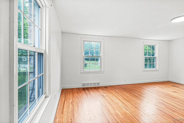 5 Glencrest Blvd, New Hartford, NY 13413 - spare room with plenty of natural light, wood finished floors, and baseboards