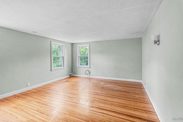 5 Glencrest Blvd, New Hartford, NY 13413 - unfurnished room featuring a textured ceiling, wood finished floors, and baseboards