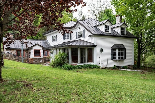 1466 Grant Rd, Russia, NY 13324 - rear view of property with a standing seam roof, a chimney, a yard, a sunroom, and metal roof