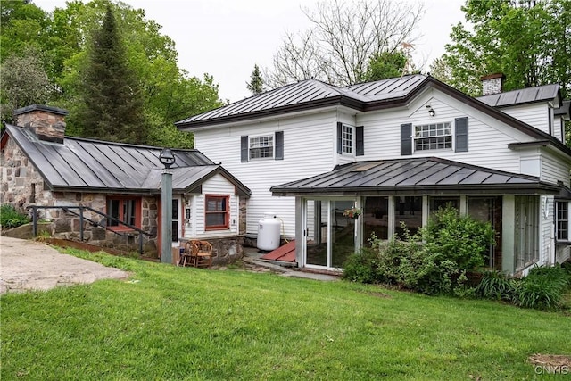 1466 Grant Rd, Russia, NY 13324 - back of house featuring a standing seam roof, metal roof, and a chimney