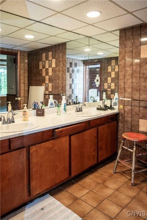 1466 Grant Rd, Russia, NY 13324 - bathroom with double vanity, tile walls, and a paneled ceiling