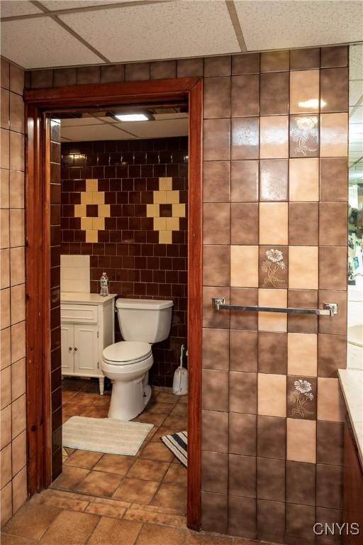 1466 Grant Rd, Russia, NY 13324 - bathroom featuring toilet and tile walls