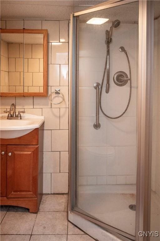 1466 Grant Rd, Russia, NY 13324 - full bath with a shower stall, vanity, tile patterned flooring, and tile walls
