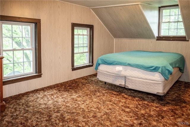 1466 Grant Rd, Russia, NY 13324 - bedroom with multiple windows, carpet flooring, vaulted ceiling, and wooden walls