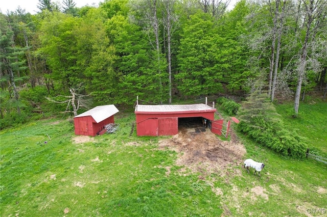 1466 Grant Rd, Russia, NY 13324 - view of yard featuring an outbuilding and a view of trees