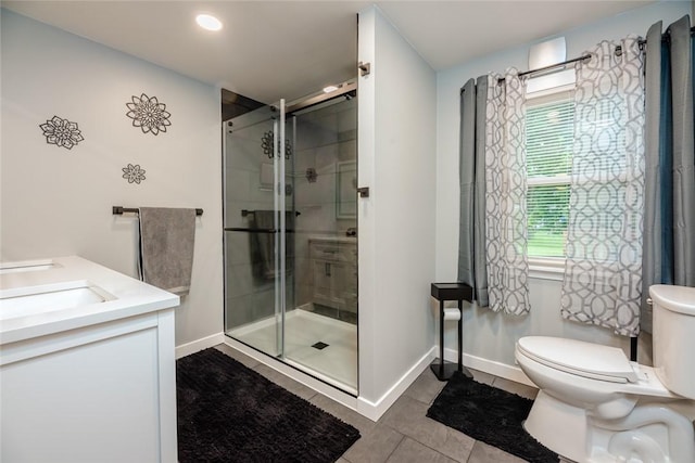 25 San Mateo Rd, Chili, NY 14624 - bathroom featuring toilet, tile patterned floors, a shower stall, double vanity, and baseboards