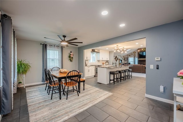 25 San Mateo Rd, Chili, NY 14624 - tiled dining area featuring a chandelier, a sink, ceiling fan, baseboards, and recessed lighting