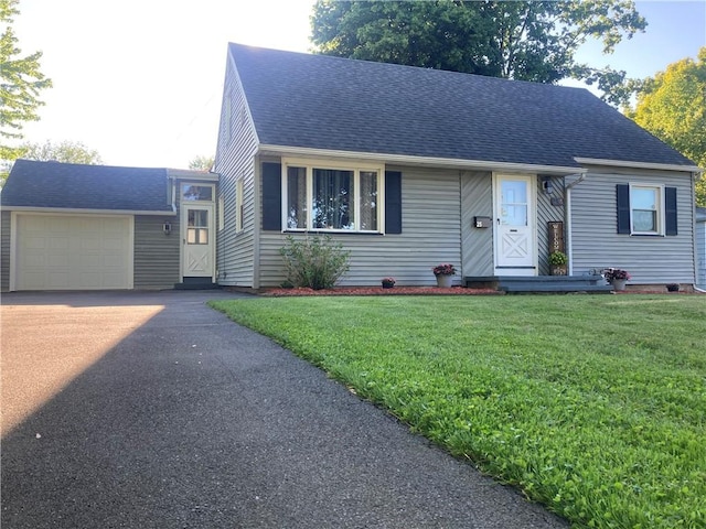 25 San Mateo Rd, Chili, NY 14624 - view of front of property featuring driveway, roof with shingles, a front yard, and an attached garage