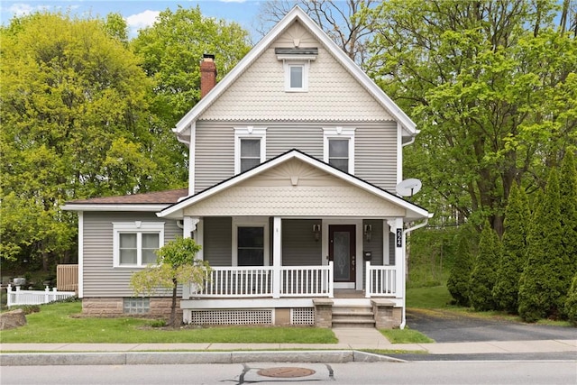 224 Lyell Ave, Ogden, NY 14559 - view of front facade with covered porch and a chimney