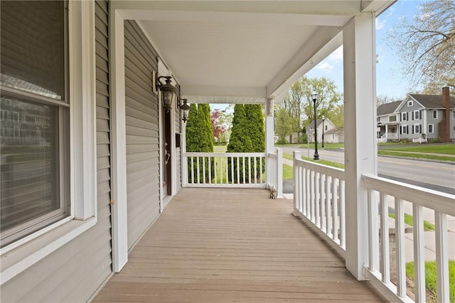 224 Lyell Ave, Ogden, NY 14559 - wooden porch with a residential view