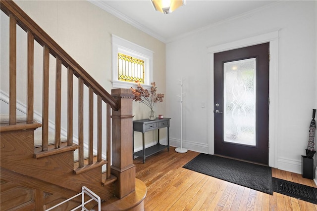 224 Lyell Ave, Ogden, NY 14559 - entrance foyer featuring hardwood / wood-style floors, stairs, crown molding, and baseboards