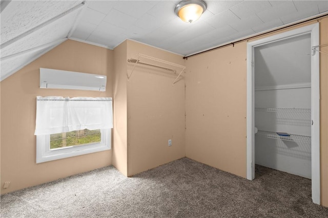 224 Lyell Ave, Ogden, NY 14559 - unfurnished bedroom featuring carpet, a wall mounted AC, a closet, and vaulted ceiling