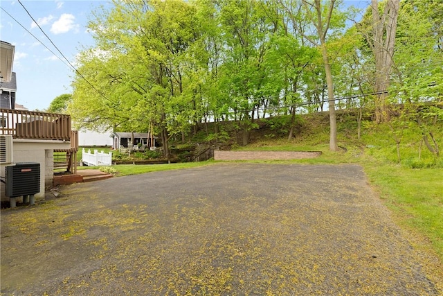 224 Lyell Ave, Ogden, NY 14559 - view of yard with stairway, a wooden deck, and central air condition unit