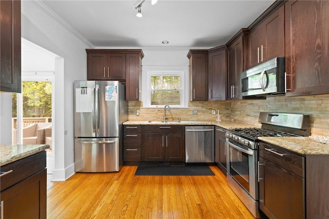 224 Lyell Ave, Ogden, NY 14559 - kitchen featuring appliances with stainless steel finishes, a sink, plenty of natural light, light wood finished floors, and ornamental molding
