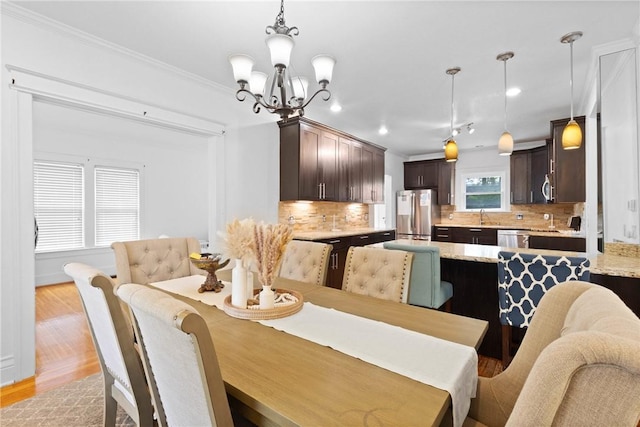 224 Lyell Ave, Ogden, NY 14559 - dining space with a chandelier, light wood-style floors, recessed lighting, and crown molding