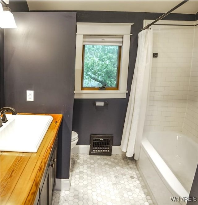 7401 Seneca St, Elma, NY 14052 - bathroom featuring baseboards, toilet, vanity, and shower / tub combo with curtain