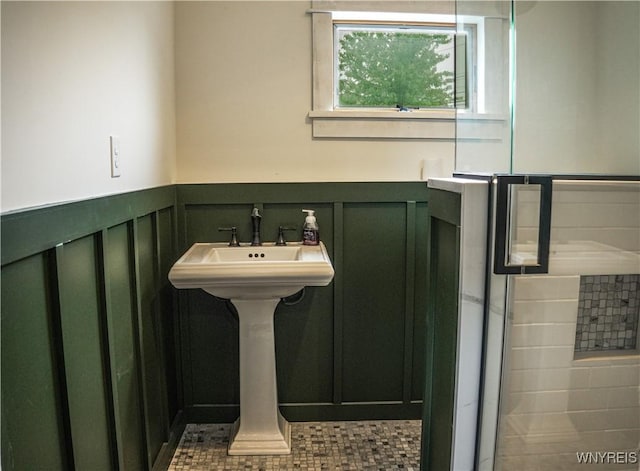 7401 Seneca St, Elma, NY 14052 - bathroom featuring a wainscoted wall and a decorative wall