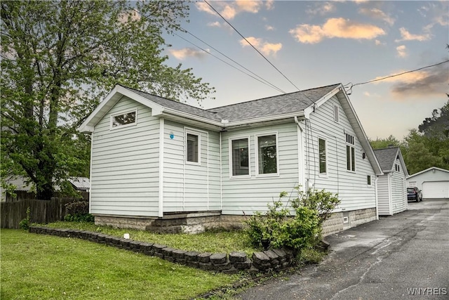 7401 Seneca St, Elma, NY 14052 - view of side of home with a garage, an outdoor structure, and a shingled roof