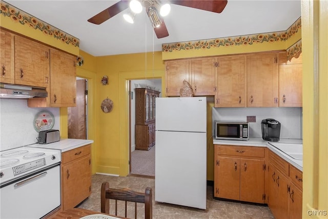 329 Hazelhurst Ave, Syracuse, NY 13206 - kitchen with white appliances, under cabinet range hood, ceiling fan, and light countertops