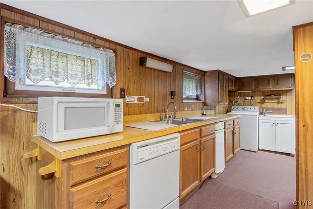 329 Hazelhurst Ave, Syracuse, NY 13206 - kitchen featuring white appliances, washer / dryer, a sink, light countertops, and carpet flooring
