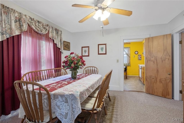 329 Hazelhurst Ave, Syracuse, NY 13206 - carpeted dining space with a ceiling fan and baseboards