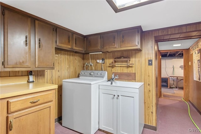 329 Hazelhurst Ave, Syracuse, NY 13206 - laundry area with washer / dryer, cabinet space, wood walls, and light carpet