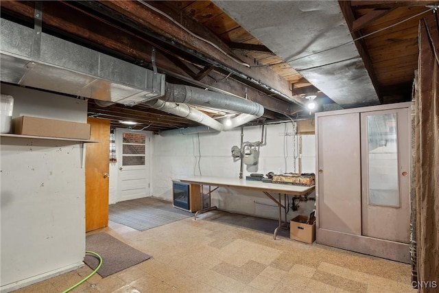 329 Hazelhurst Ave, Syracuse, NY 13206 - basement with tile patterned floors, a workshop area, and gas meter