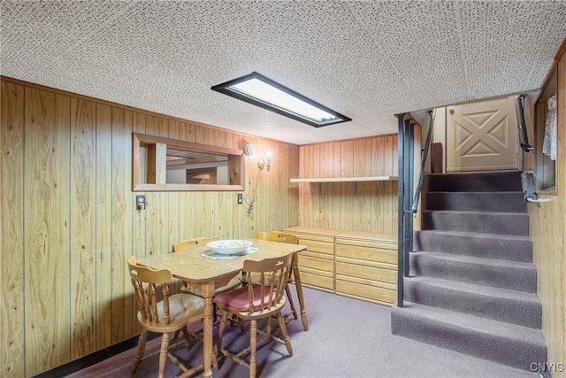 329 Hazelhurst Ave, Syracuse, NY 13206 - carpeted dining room featuring stairs and wood walls