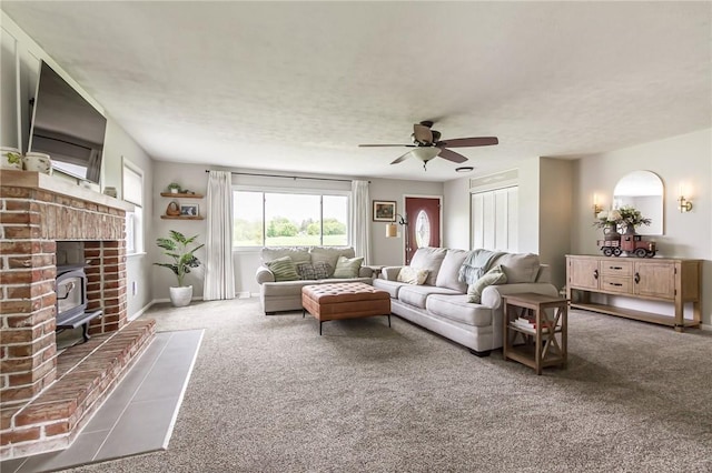 2935 Main St, York, NY 14533 - carpeted living area with a wood stove and ceiling fan