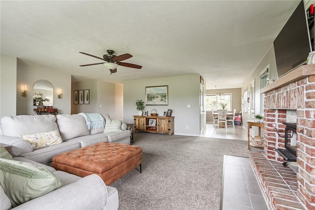 2935 Main St, York, NY 14533 - carpeted living room with a ceiling fan, tile patterned floors, and baseboards