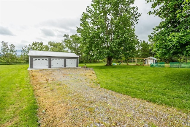 2935 Main St, York, NY 14533 - view of green lawn featuring an outbuilding and a garage