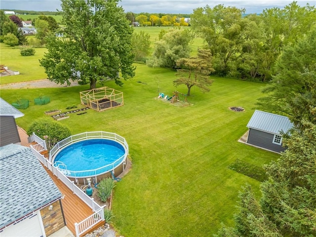 2935 Main St, York, NY 14533 - swimming pool featuring a yard and view of wooded area