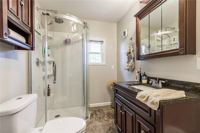 2935 Main St, York, NY 14533 - full bath featuring toilet, a shower stall, vanity, and stone finish flooring