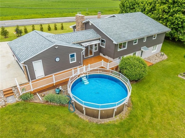 2935 Main St, York, NY 14533 - view of swimming pool with a deck and a lawn