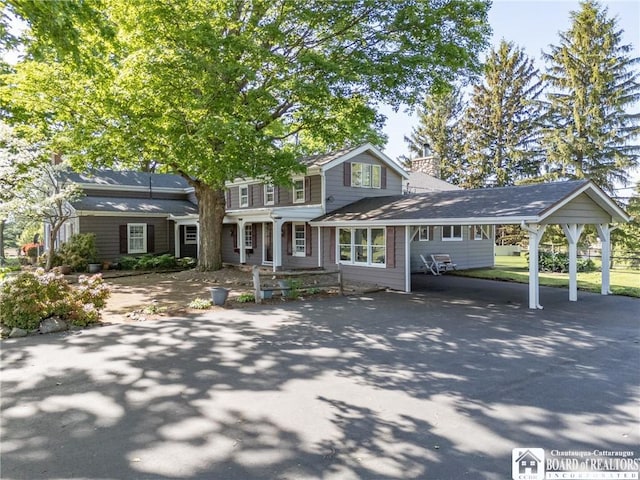 10280 Christy Rd, Sheridan, NY 14063 - view of front of house featuring a chimney, asphalt driveway, and an attached carport