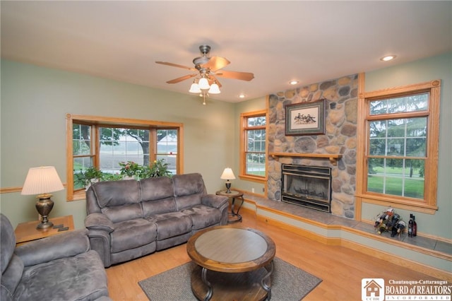10280 Christy Rd, Sheridan, NY 14063 - living area featuring ceiling fan, wood finished floors, a fireplace, and recessed lighting