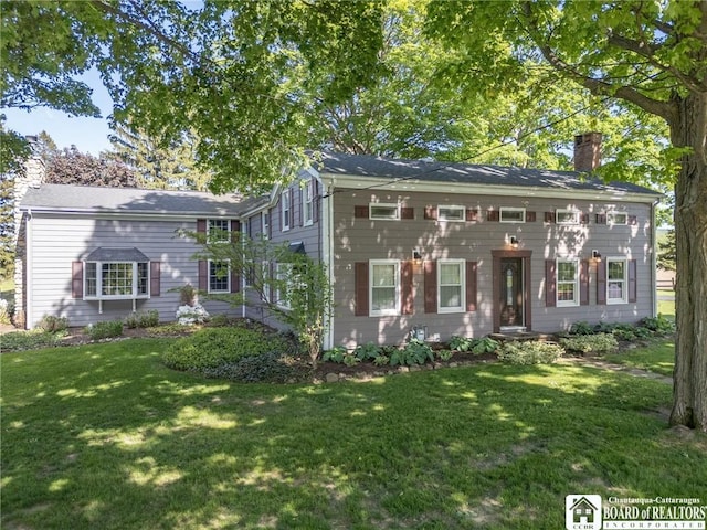 10280 Christy Rd, Sheridan, NY 14063 - colonial-style house with a front yard and a chimney