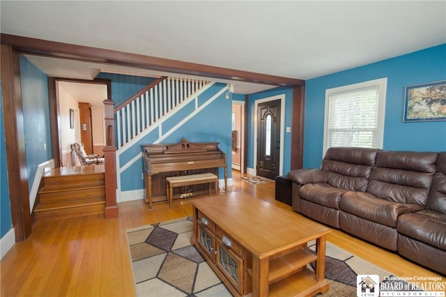 10280 Christy Rd, Sheridan, NY 14063 - living room featuring stairway, light wood finished floors, and baseboards